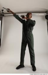 ERIC STANDING POSE WITH GUNS